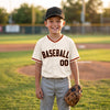 Custom Cream - Black - Orange - Old Gold Baseball Script Baseball Jersey – youth size worn by a kid