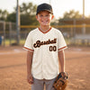 Custom Cream - Black - Orange - Old Gold Classic Script Baseball Jersey – youth size worn by a kid