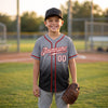 Custom Gray - White - Black - Red Fade Baseball Jersey – youth size worn by a kid