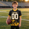 Custom Black - White - Gold Graphic Splash Pattern Football Jersey – youth size worn by a kid