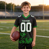 Custom Black - White - Grass Green Graphic Splash Pattern Football Jersey – youth size worn by a kid