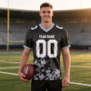 Custom Black - Gray - White Graphic Splash Pattern Football Jersey – worn by a man