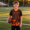 Custom Brown - Orange Graphic Splash Pattern Football Jersey – youth size worn by a kid
