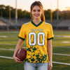Custom Gold - White - Green Graphic Splash Pattern Football Jersey – worn by a woman