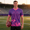 Custom Purple - Pink Graphic Splash Pattern Football Jersey – worn by a man