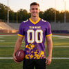 Custom Purple - White - Gold Graphic Splash Pattern Football Jersey – worn by a man
