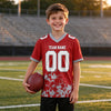 Custom Red - White - Gray Graphic Splash Pattern Football Jersey – youth size worn by a kid