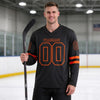 Custom Black - Orange Triple Stripes Hockey Jersey – worn by a man