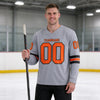 Custom Gray - Orange - Black Triple Stripes Hockey Jersey – worn by a man