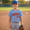 Custom Pinstripe Baseball Jersey – Light Blue Orange Royal Blue – youth size worn by a kid
