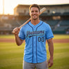 Custom Piped Baseball Jersey – Light Blue Navy Blue Teal – worn by a man