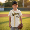 Custom Cream - Black - Old Gold Piped Pinstripe Baseball Jersey – youth size worn by a kid